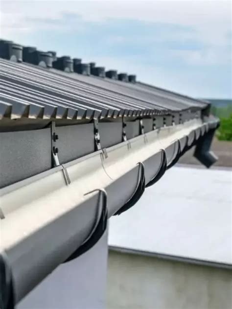 do houses with metal roofs need gutters|hanging gutters on metal roof.